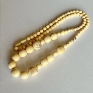 Off white old plastic or bone necklace